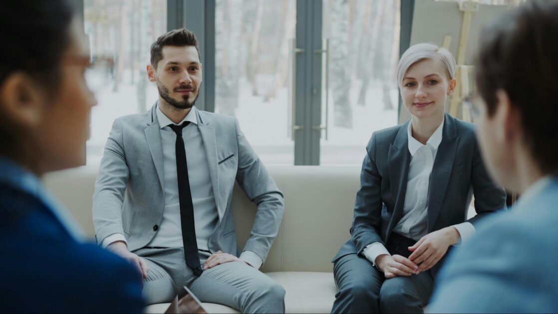 Business professionals and go-to-market experts discussing their strategy.