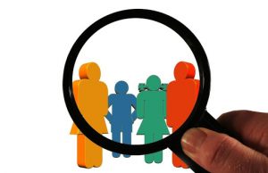 Magnifying glass on illustration of a group of people