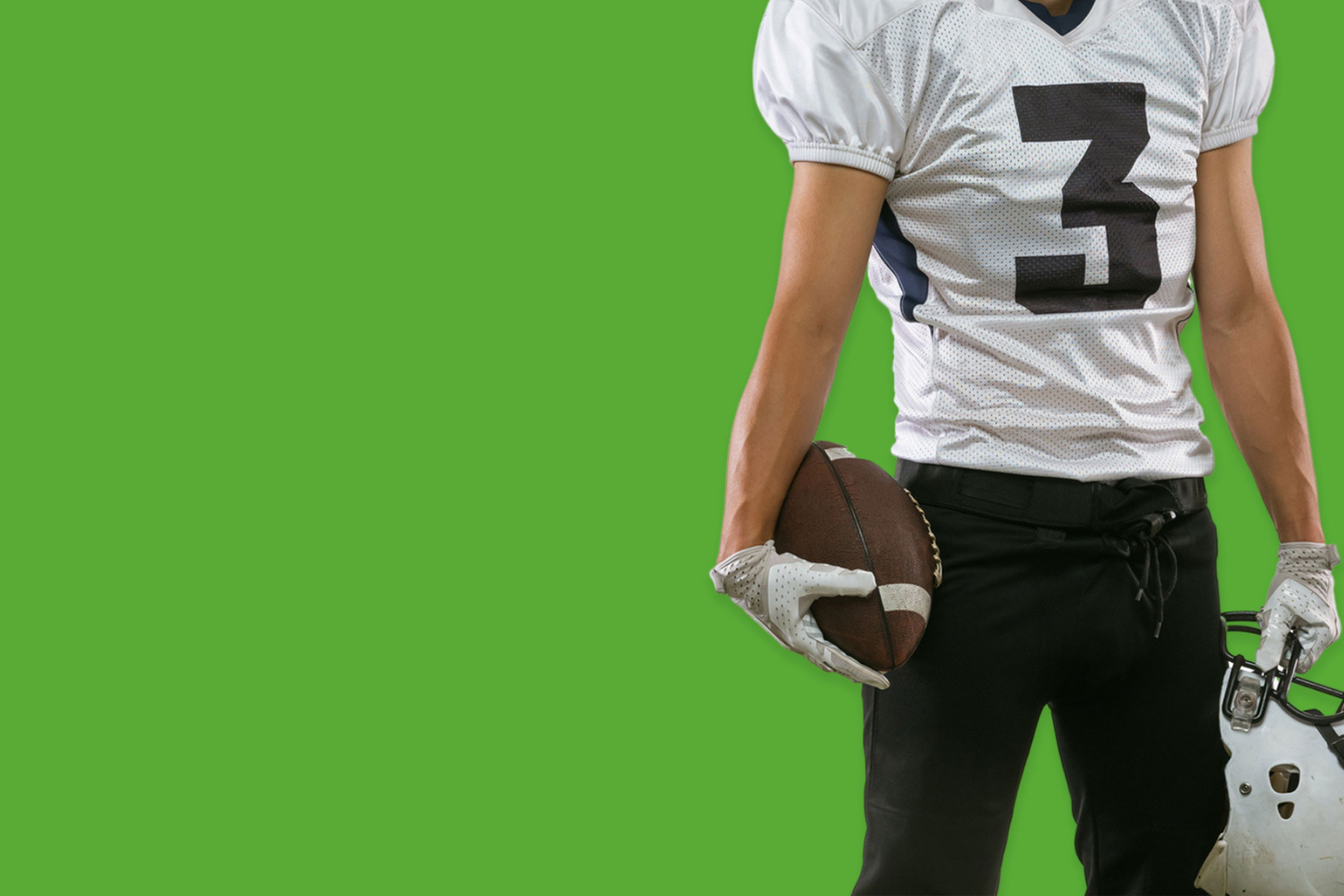 American football player holding football
