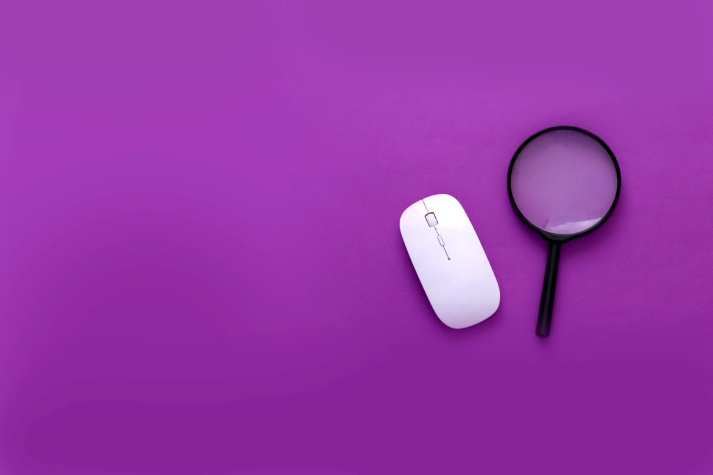 PC mouse, magnifier on purple background - for What is Product Marketing, and Why Does it Matter?