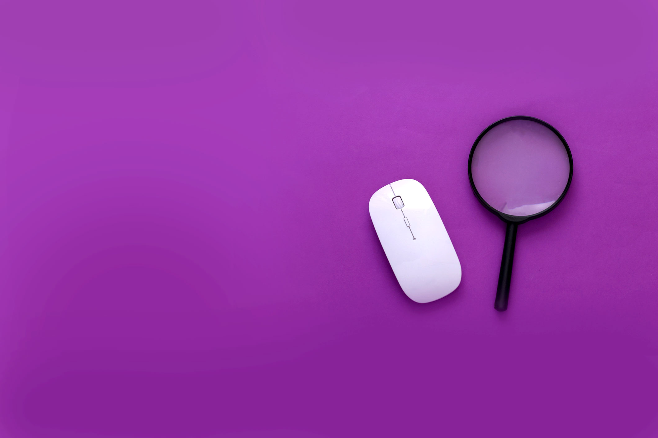 Pc mouse, magnifier on purple background. For What is Product Marketing, and Why Does it Matter
