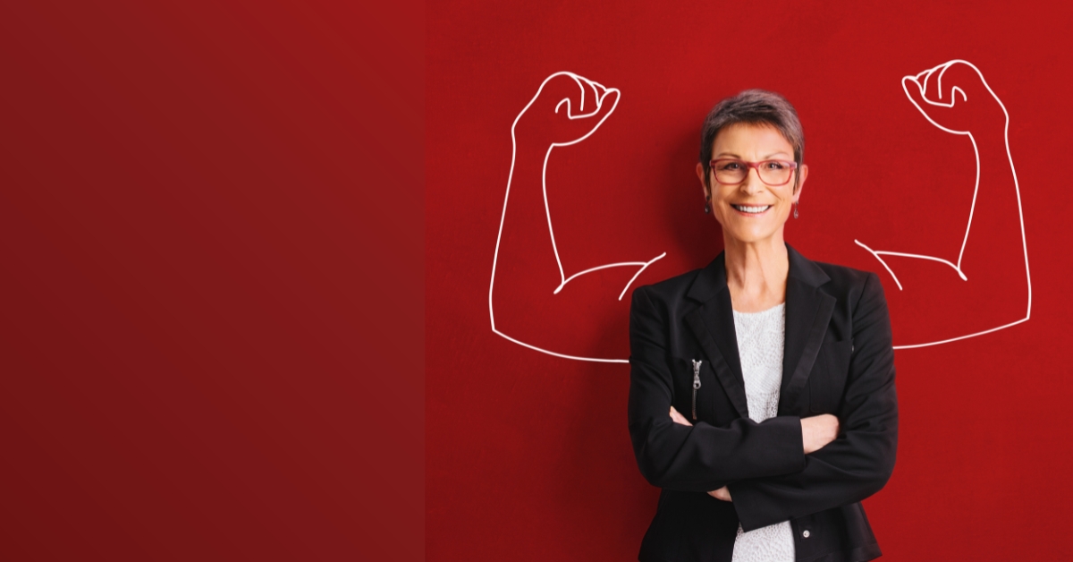 woman with short hair and chalked arms flexing behind her on a red background for campaigns collaboration
