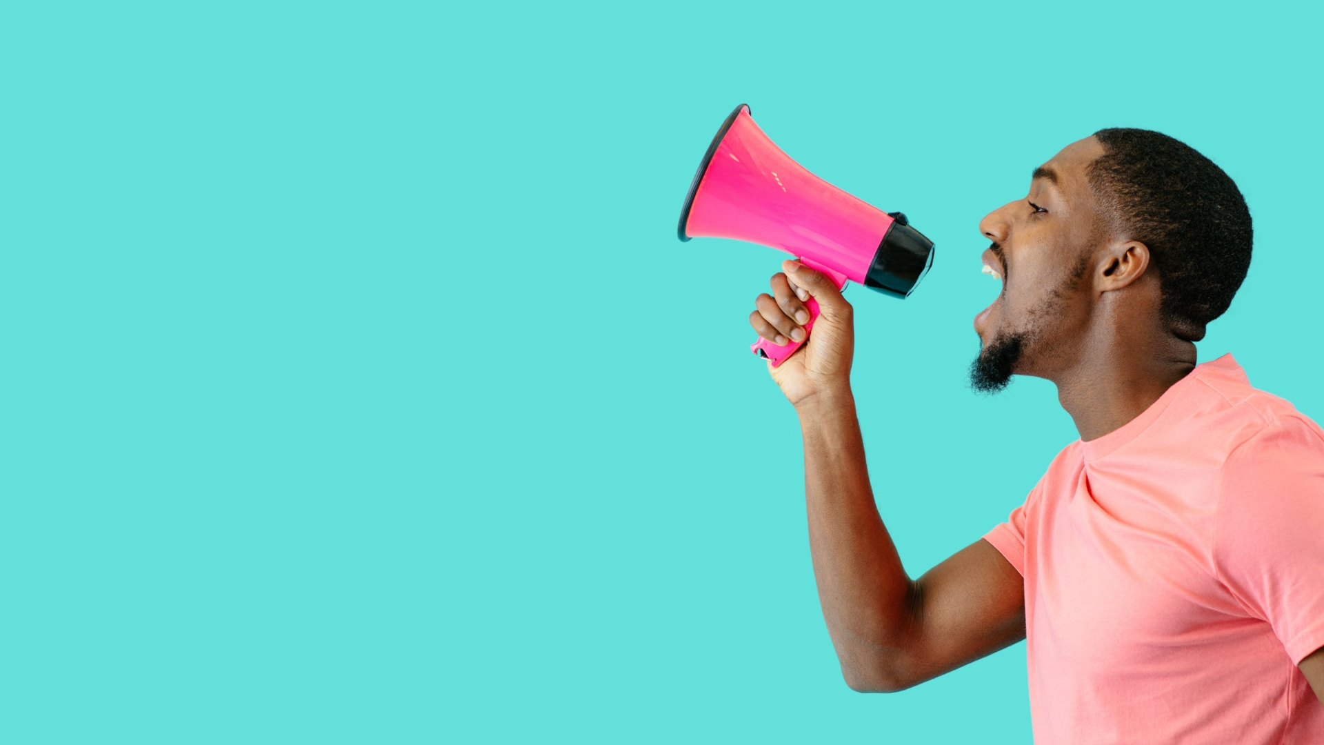 man in pink shirt with pink bullhorn on aqua background for product marketing takeaways
