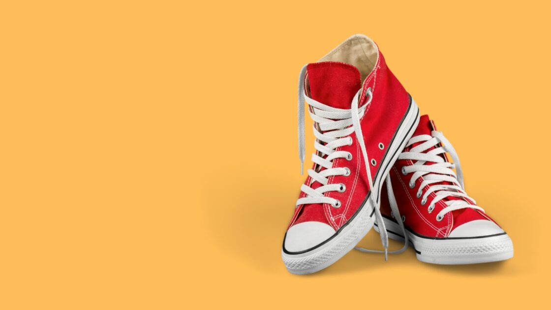 Red sneakers on an orange background for two-pagers