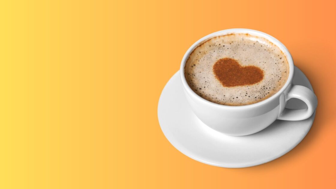 coffee cup with heart in foam on orange background for demand gen