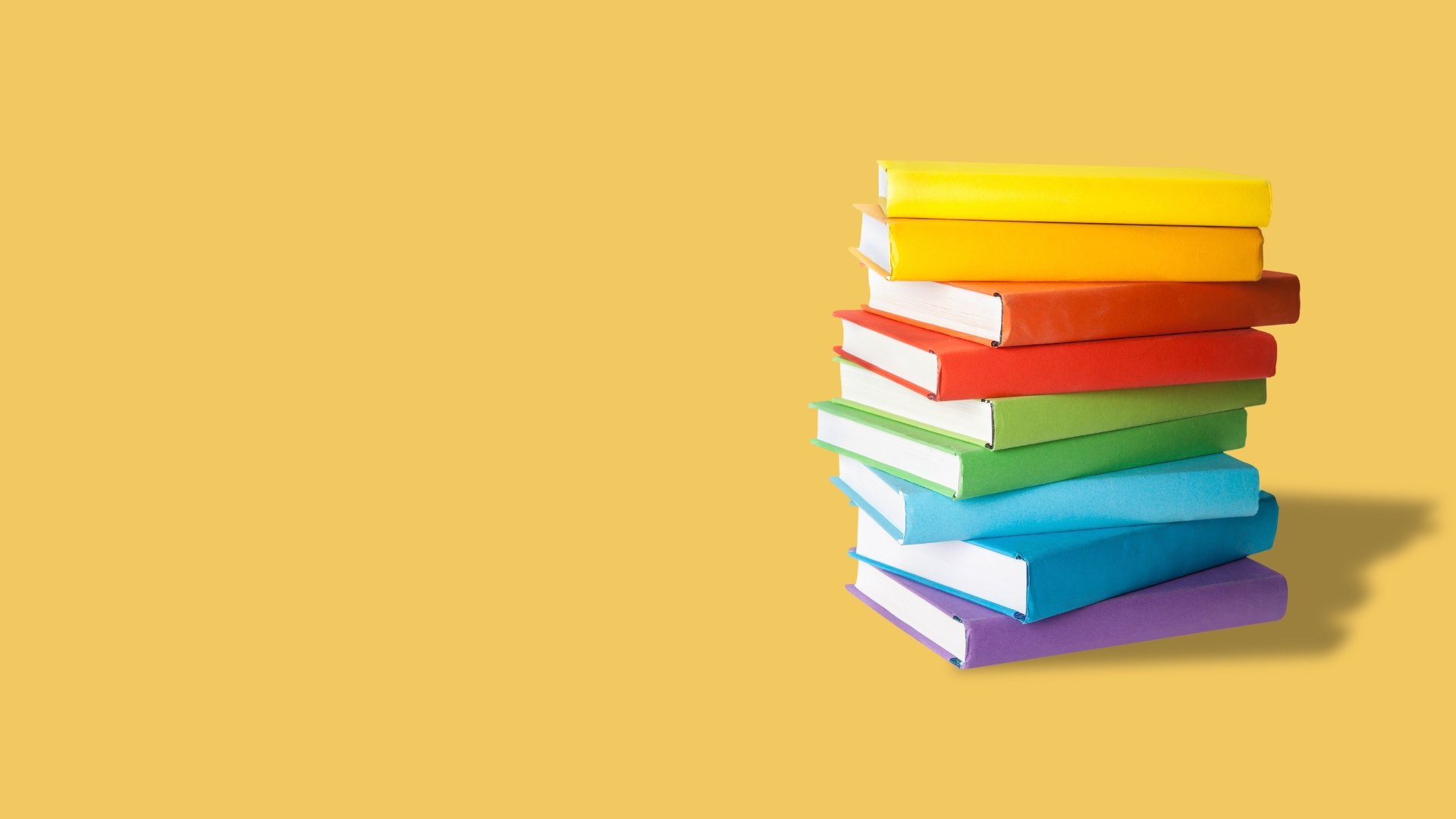rainbow-colored books on yellow background for platform centered GTM