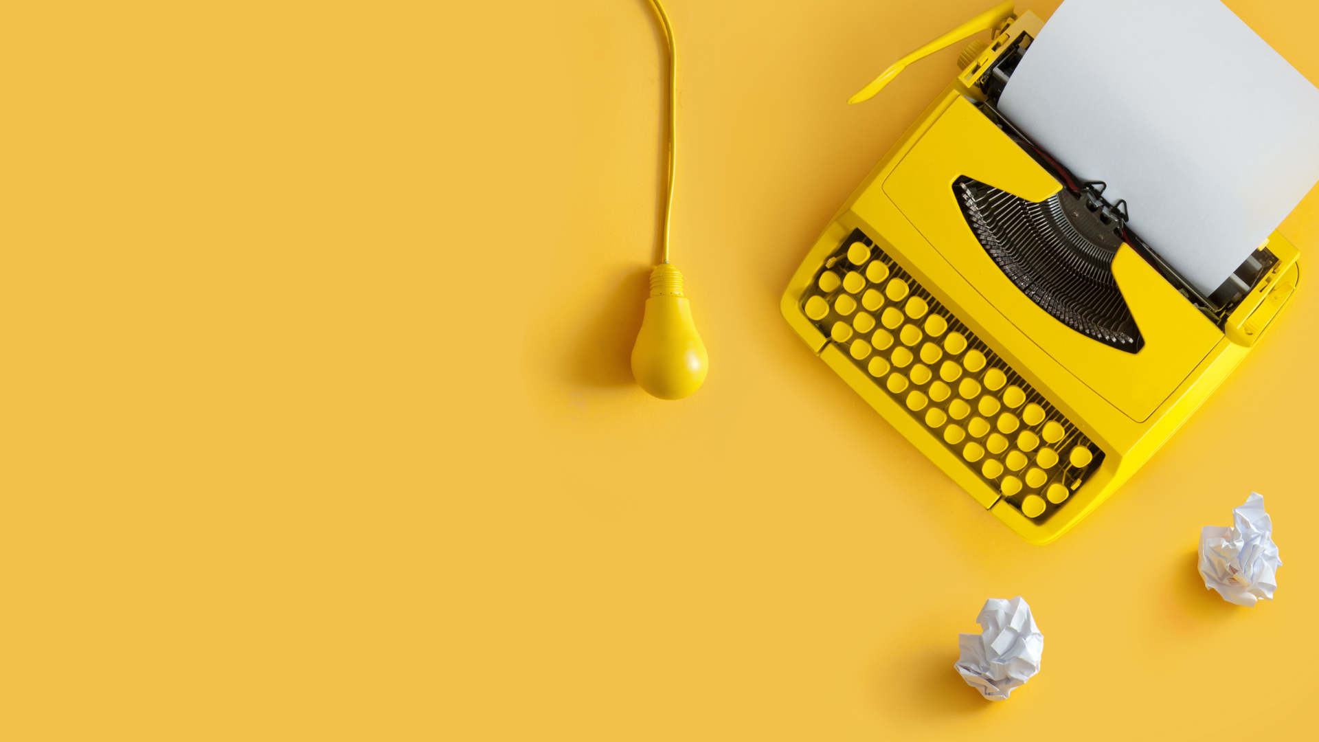 typewriter on yellow background for writing intentional content