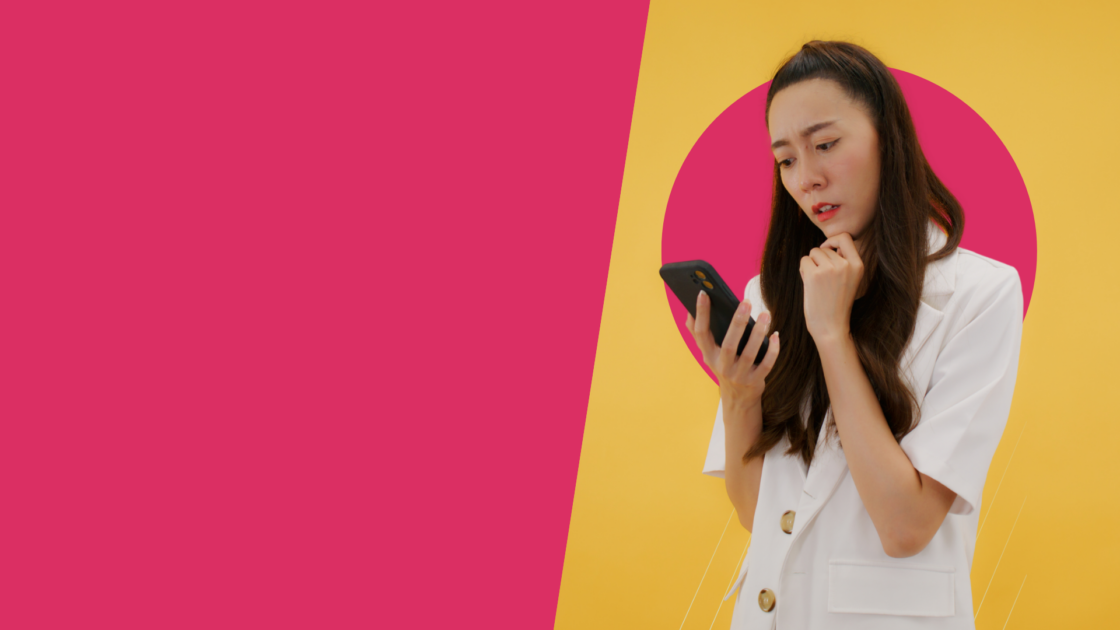 Person looking concerned at smartphone, representing uncertainty about AI’s impact on social media marketing jobs and human creativity.