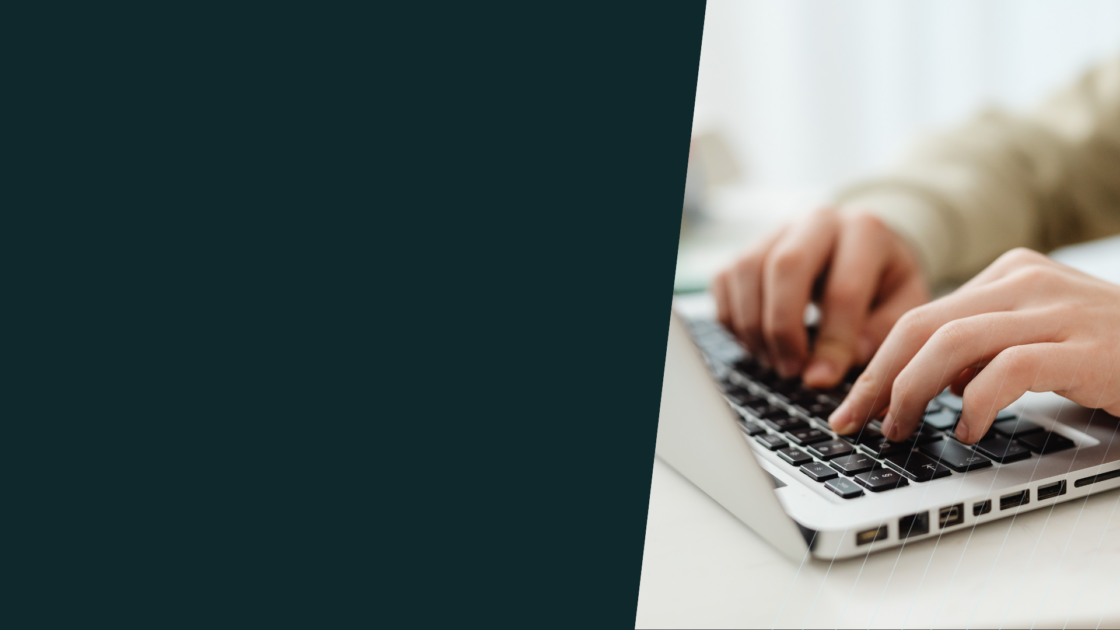 Person typing on laptop, representing product messaging strategy development and execution across digital marketing channels.