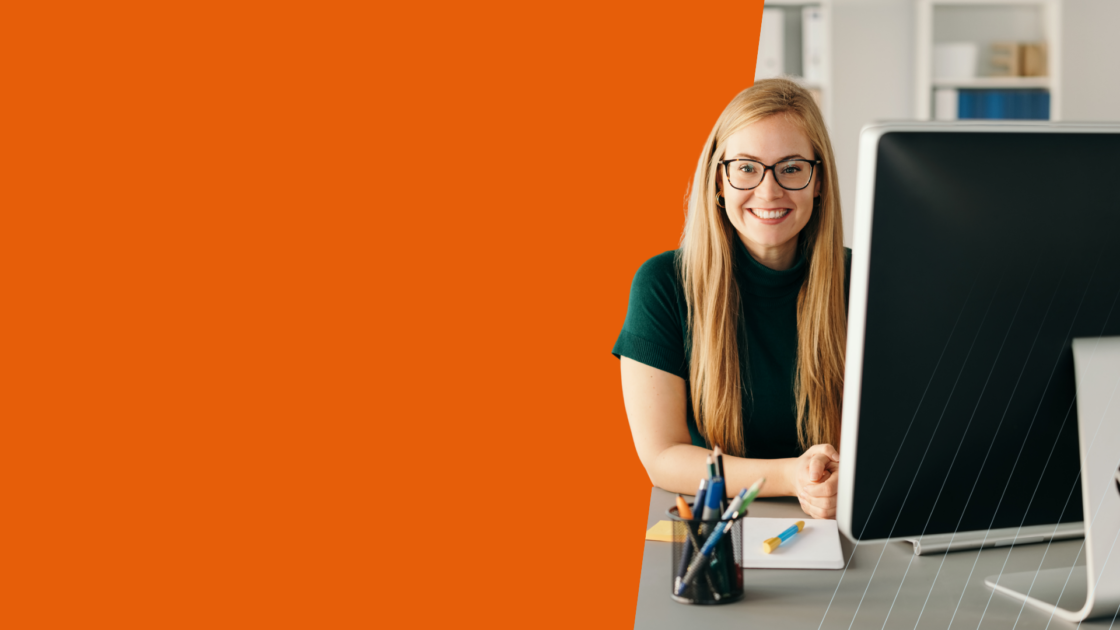Professional working at a computer, representing practical AI use cases for product marketing and how teams apply AI to real-world marketing execution and strategy