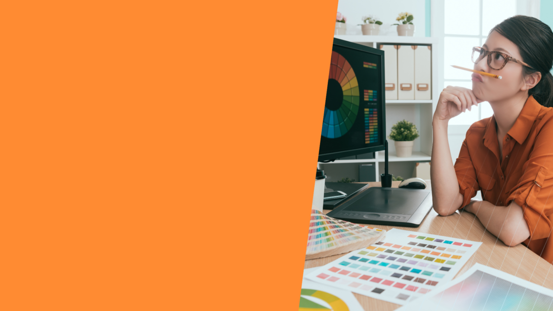 Designer reviewing color palettes and visual elements on a screen, highlighting the importance of design in the AI era for brand differentiation and clarity.