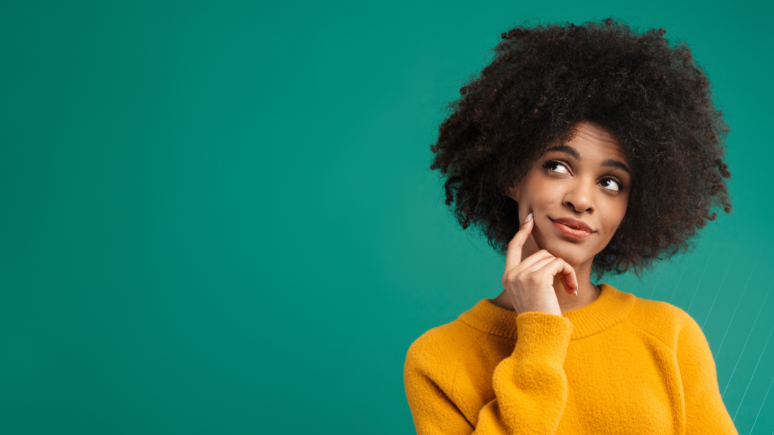 Professional woman in a thoughtful pose against a green background, representing the complexity and often misunderstood role of product marketing.