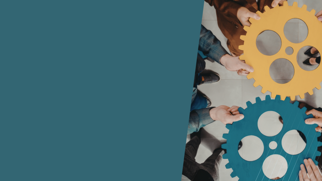 Team members aligning large interlocking gears, illustrating how an AI-first agency combines human expertise, strategic oversight, and AI-powered execution to help mature GTM teams operate more effectively.
